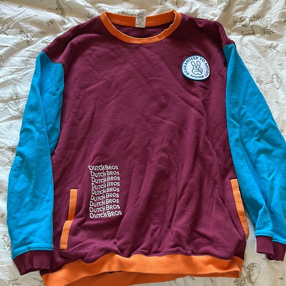 multi-colored dutch bros patch sweater